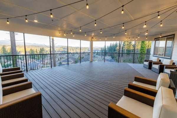Outdoor patio area with seating and string lights
