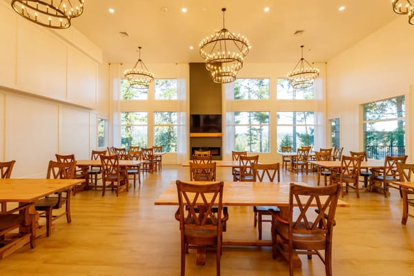 Bright dining room with wooden tables and chairs