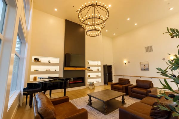 Cozy common area with comfortable seating and a piano