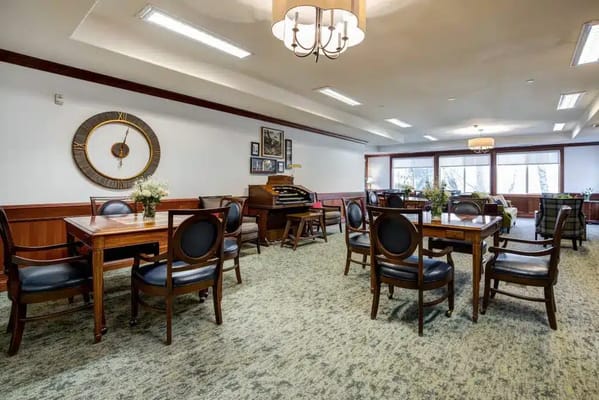Interior view of a common area with tables and chairs