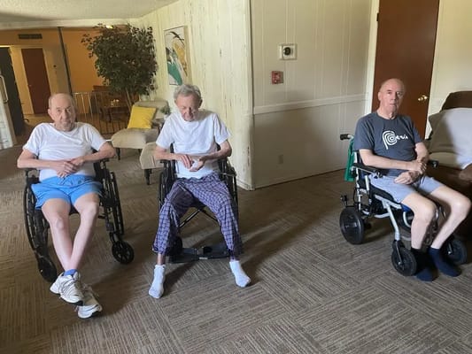 Residents sitting in a common area of the facility