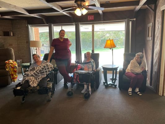 Residents and staff interacting in a common area