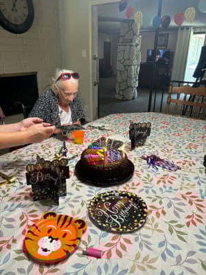 Resident celebrating a birthday with cake