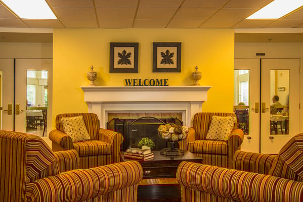 Cozy sitting area with welcoming decor and a fireplace