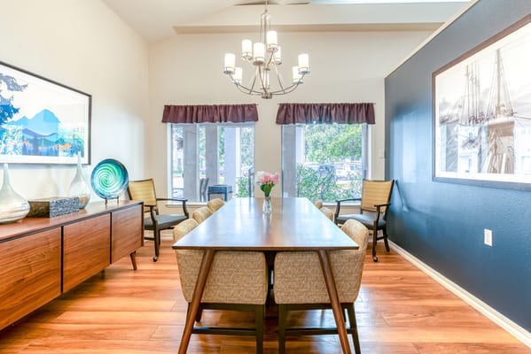 Bright and inviting common area with a dining table
