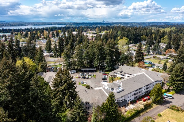 Aerial view of the Renton Assisted Living facility surrounded by trees