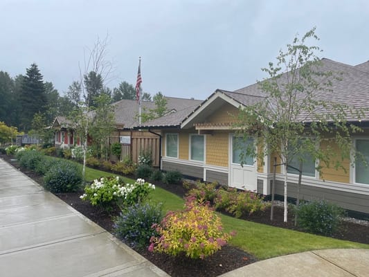 Exterior view of the Cottages of Renton with gardens