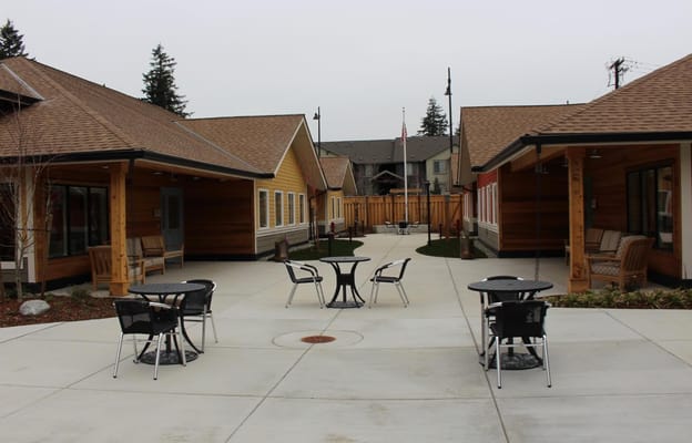 Outdoor courtyard area with seating and gardens