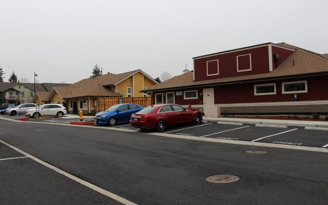 Parking area with several vehicles and facility buildings