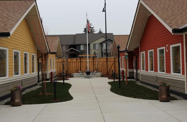 A landscaped walkway between residential cottages