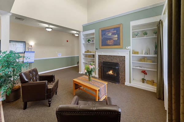 cozy common area with seating and fireplace