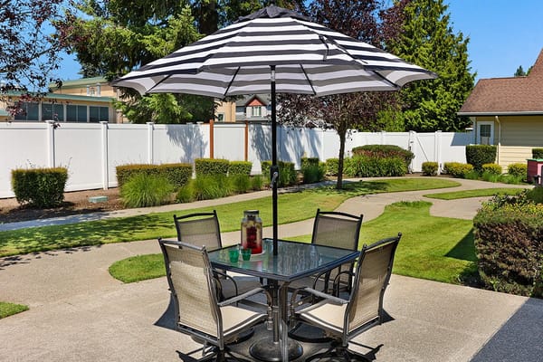 Outdoor dining area with table and umbrella