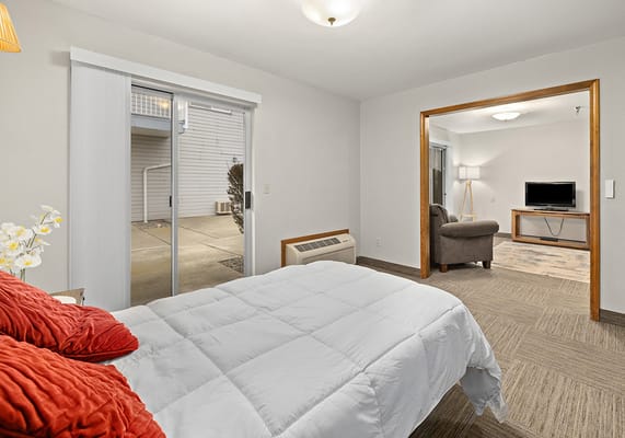 Cozy private room with bed and seating area