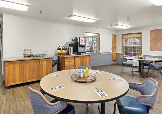 Bright dining area with tables and chairs