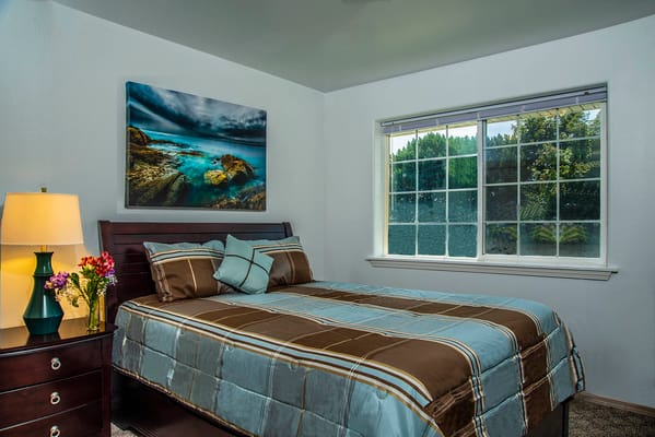 Cozy private resident room with a bed and window