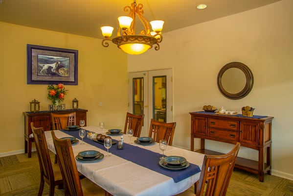 Elegant dining room with a large table and chandelier
