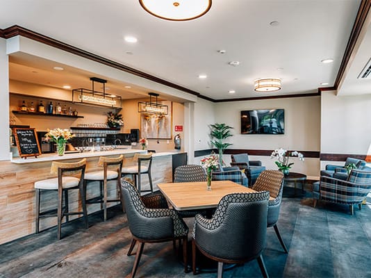 A cozy lounge area with seating and refreshments