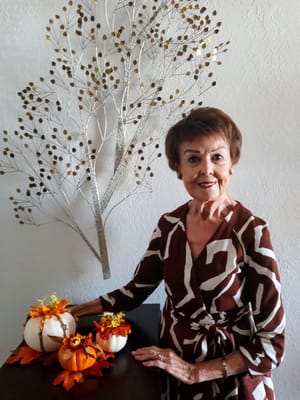 Resident decorates for fall with pumpkins