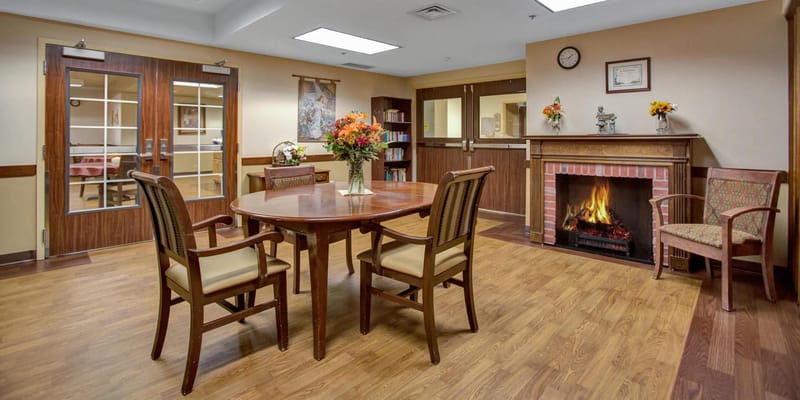 A common area with a fireplace and seating