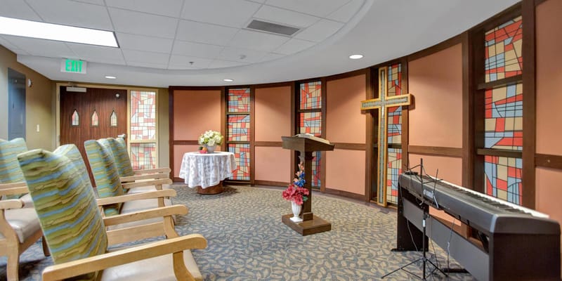 Interior chapel space with seating and decor
