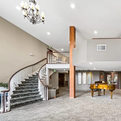 Bright and spacious lobby area with piano