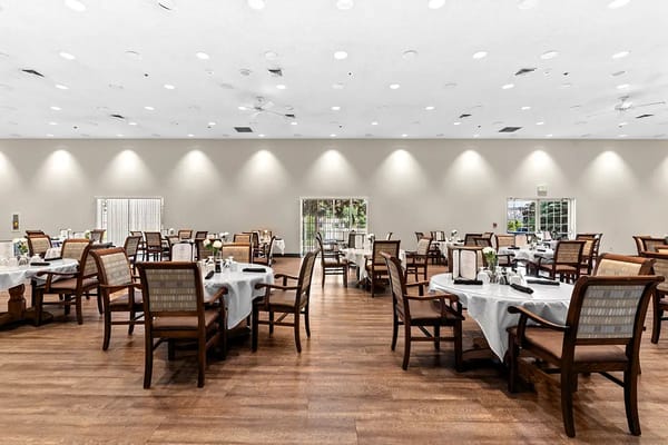 Dining room setup with tables and chairs
