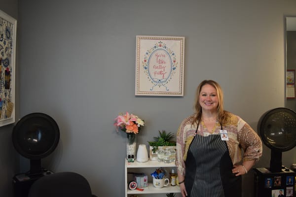 Staff member in a hair salon area