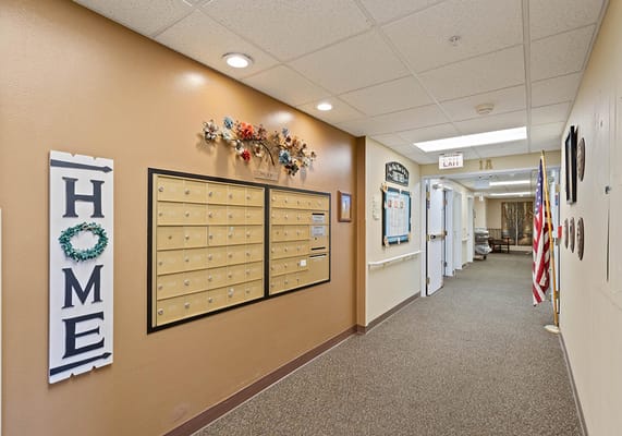 Interior hallway with mailboxes and decorations