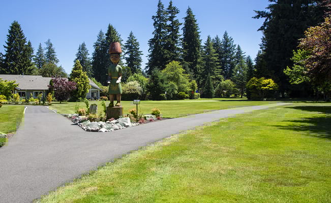 Outdoor view of a landscaped area with a garden statue