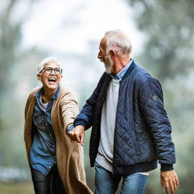 Two seniors enjoying a walk outdoors