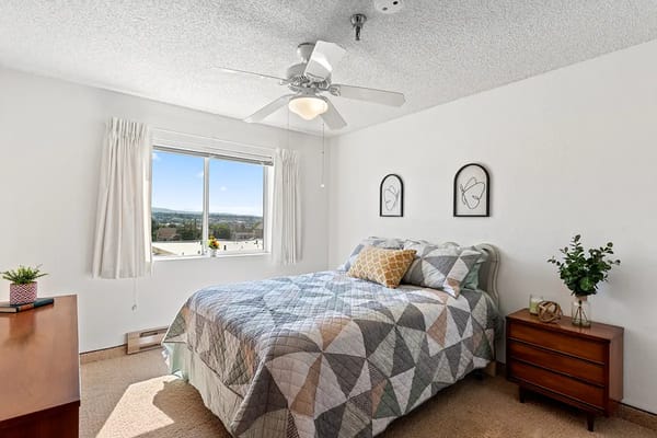 A cozy resident bedroom with a view
