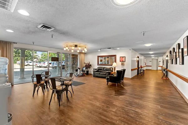 Dining area and lobby with seating and decor