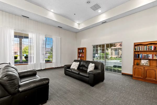 Interior common area with seating and bookshelves