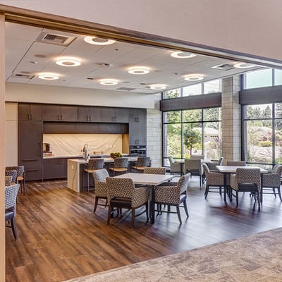 Bright common area with chairs and windows