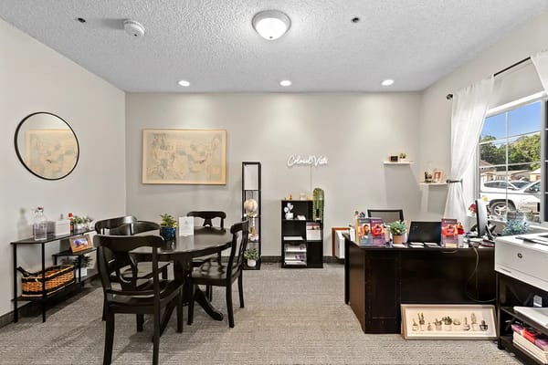 Bright common area with tables and decor