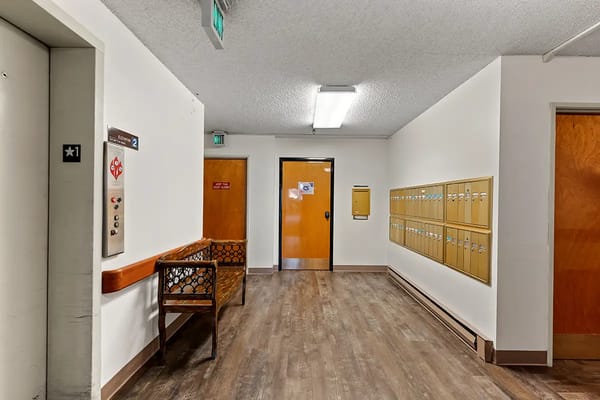 Interior corridor with mailboxes and elevator