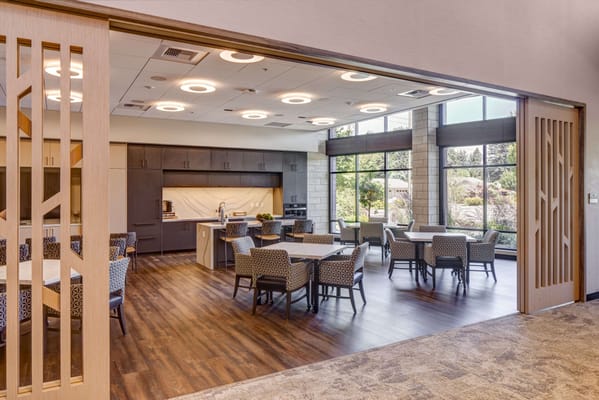 Bright and spacious common area in the facility with tables