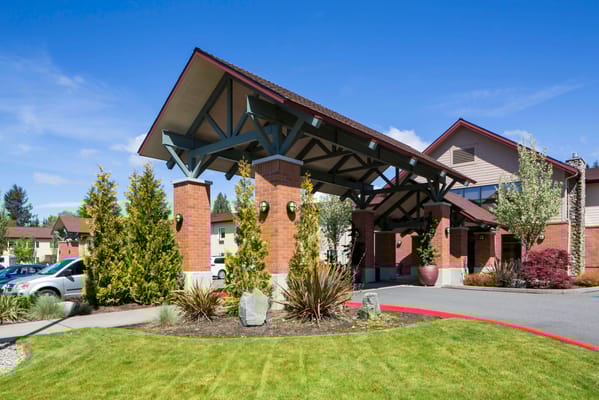 Exterior view of the facility entrance with landscaping