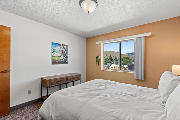 Private resident room with a bed and window view