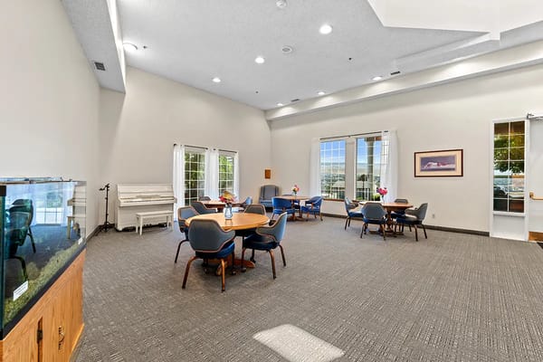 Bright common area with tables and chairs
