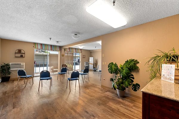 Common area with chairs and natural light