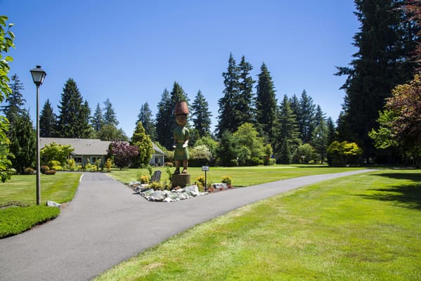 Well-kept outdoor space with a sculpture and pathway