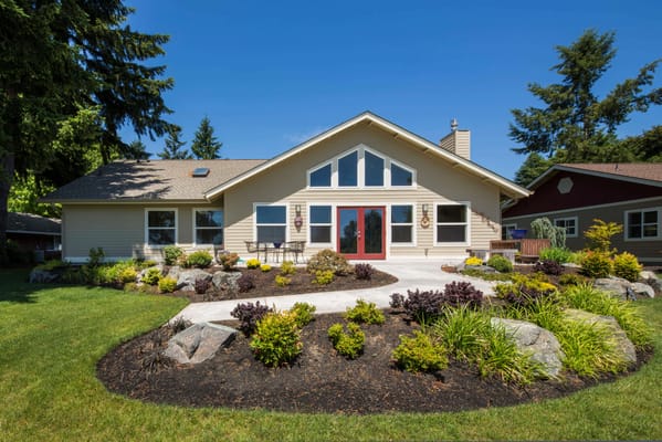 Exterior view of a senior living facility with landscaped gardens