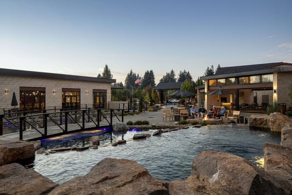 Outdoor space with water features and residents enjoying the area.