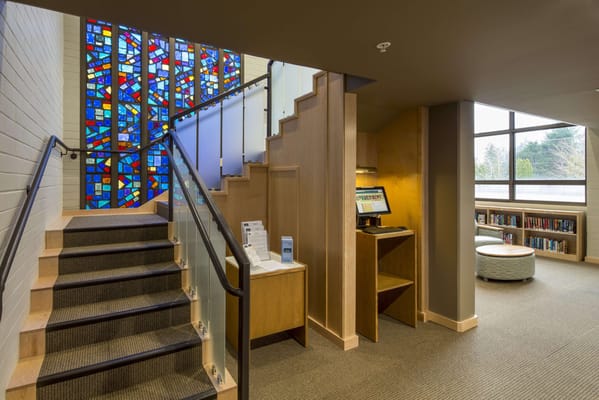 Interior view of a staircase with stained glass