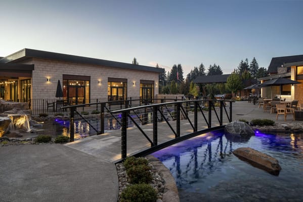 Beautiful outdoor space with a bridge and water feature