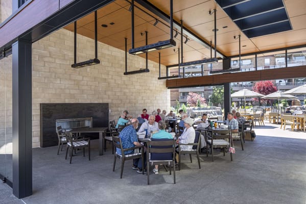 Residents enjoying an outdoor gathering on a patio