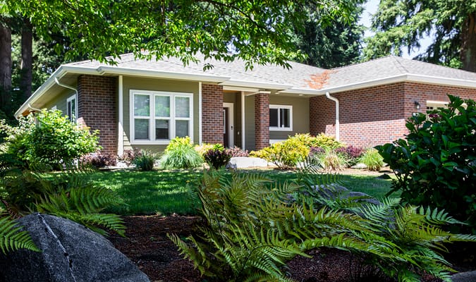 Exterior view of the facility with landscaped garden