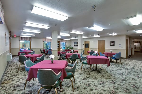 Dining area with tables and floral centerpieces