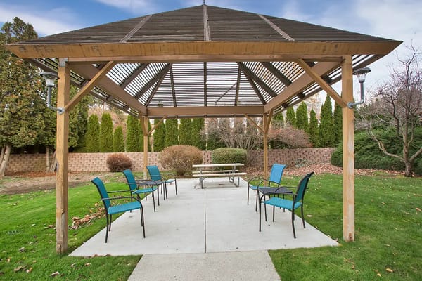 Outdoor gazebo with seating in a garden